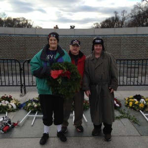 Joy and David Hendrix pose for a photo with Larry Dwyer while visiting the WWII Memorial.